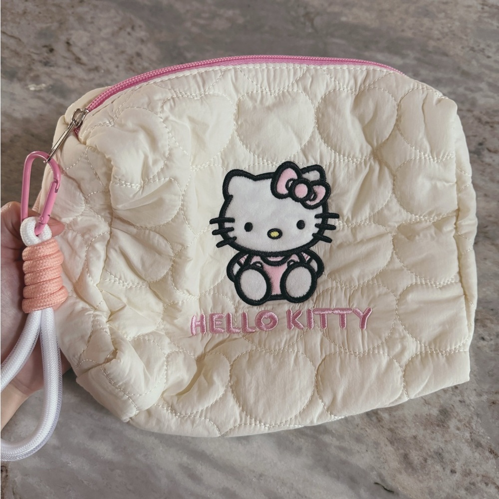 Hello kitty embroidered puffer makeup bag!